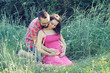 Photo: Couple future parents relaxing on grass. Couple future parents relaxing on grass.