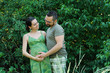 Photo: Happy couple future parents in the park. Happy couple future parents in the park.