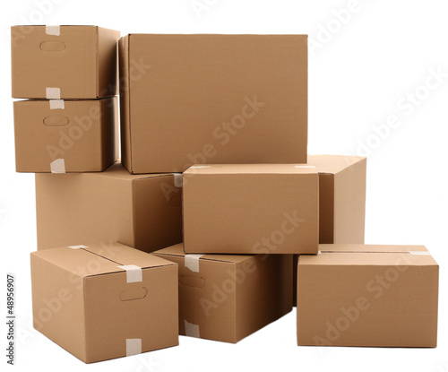 Photo: Carton boxes isolated over white background Carton boxes isolated over white background