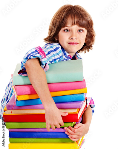 Photo: Child with stack of books. Child with stack of books.