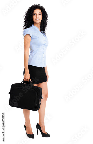 Photo: Businesswoman full length holding a briefcase Businesswoman full length holding a briefcase