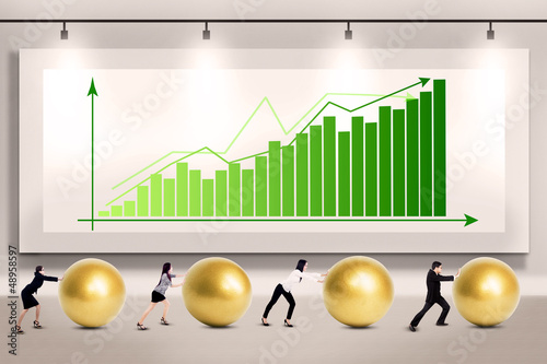 Photo: Business people push profit Business people push profit