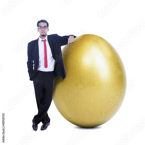 Photo: Businessman and golden egg Businessman and golden egg