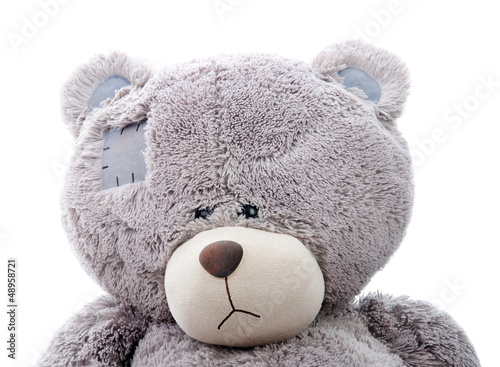Photo: sad teddy bear. Close-up sad teddy bear. Close-up