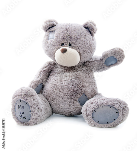 Photo: cheerful teddy bear. isolated cheerful teddy bear. isolated