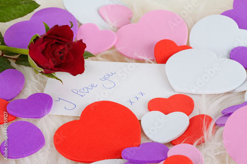 Photo: Romantic note: I love with red rose and hearts Romantic note: I love with red rose and hearts