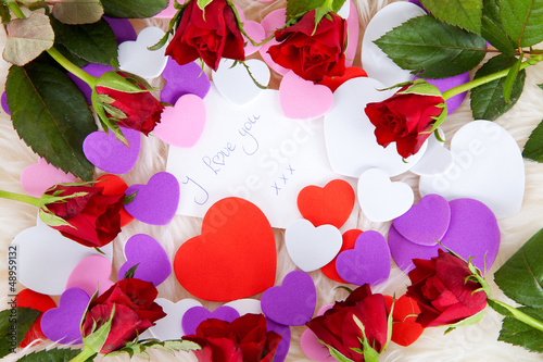 Photo: Romantic note: I love with red roses and hearts Romantic note: I love with red roses and hearts