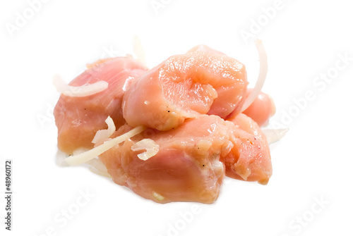 Photo: some slices of raw chicken meat on white background some slices of raw chicken meat on white background