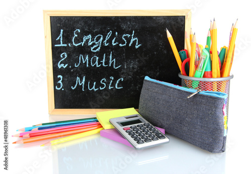 Photo: pencil box with school equipment and timetable isolated on pencil box with school equipment and timetable isolated on