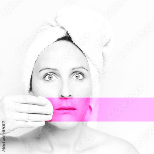 Photo: Woman with towel on her head and pink stripe Woman with towel on her head and pink stripe
