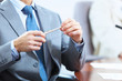 Hands of businessman laying on table