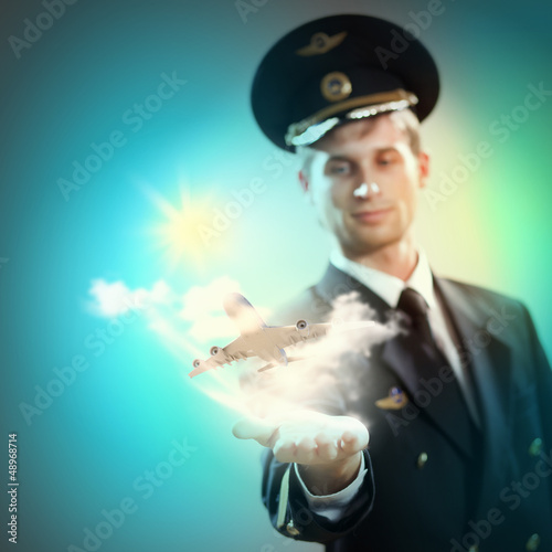 Photo: Image of pilot with plane in hand Image of pilot with plane in hand