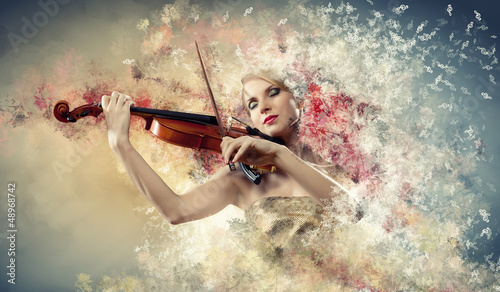 Photo: Gorgeous woman playing on violin Gorgeous woman playing on violin