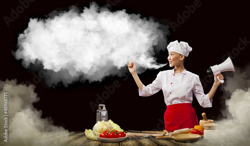 Photo: Asian female cook holding megaphone Asian female cook holding megaphone