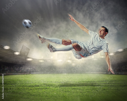 Photo: football player striking the ball football player striking the ball