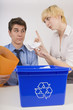 Woman Scolding Man For His Recycling Habits