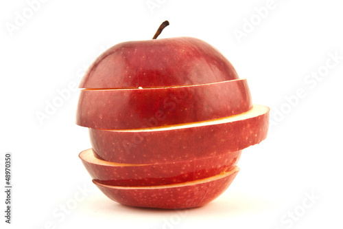 Photo: Red sliced apple isolated on white background cutout Red sliced apple isolated on white background cutout
