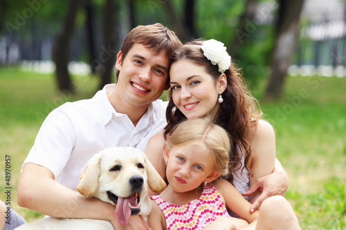 Photo: Happy family having fun outdoors Happy family having fun outdoors
