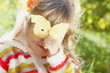Little Girl Hiding Behind the Leaf on Sunny Day