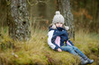 Adorable girl having fun on early spring