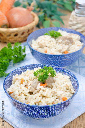 Photo: two bowls Uzbek national dish pilaf two bowls Uzbek national dish pilaf