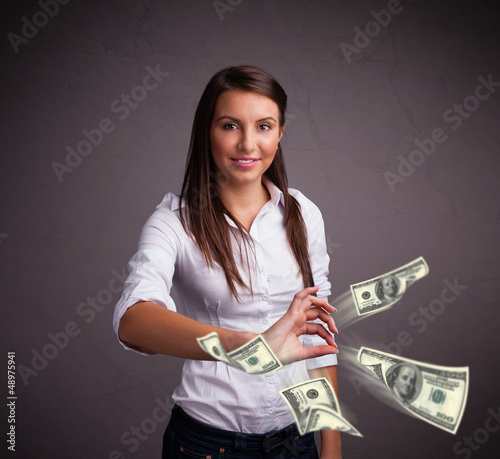 Photo: Young girl throwing money Young girl throwing money