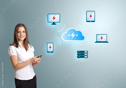 Photo: Young woman holding a phone with cloud computing network Young woman holding a phone with cloud computing network