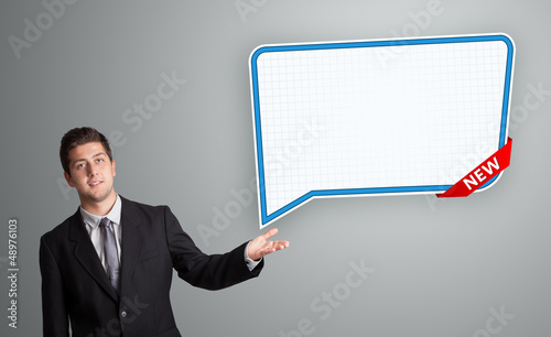 Photo: young man presenting modern speech bubble copy space young man presenting modern speech bubble copy space