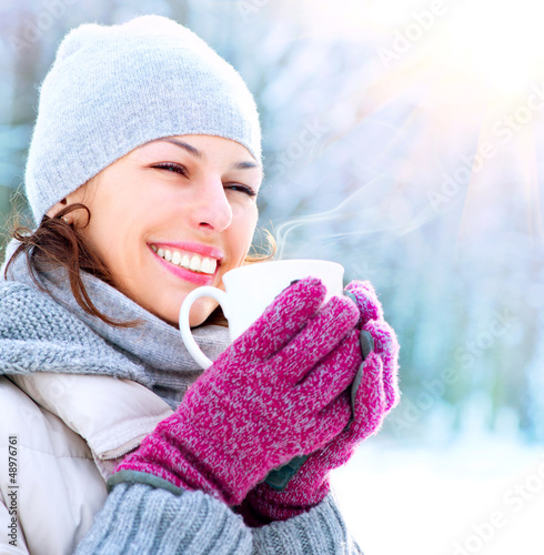 Photo: Beautiful Happy Smiling Winter Woman with Mug Outdoor Beautiful Happy Smiling Winter Woman with Mug Outdoor