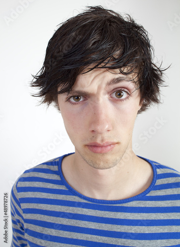 Photo: male teenager questioning his parents male teenager questioning his parents
