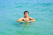 handsome boy has fun in the ocean