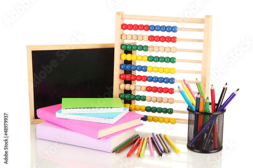 Photo: Toy abacus, school desk, books and pencils, isolated on white Toy abacus, school desk, books and pencils, isolated on white