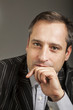 portrait of adult man isolated on dark background