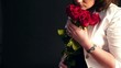 Video: woman smelling presented red roses close-up woman smelling presented red roses close-up