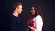 Video: young man kissing his woman with red roses young man kissing his woman with red roses