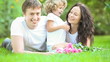 Happy family having fun outdoors in spring park