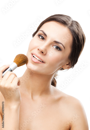 Photo: Smiling woman with make up brush, isolated Smiling woman with make up brush, isolated