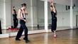 Professional dancers dancing in ballroom