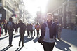 Urban girl striding through city area