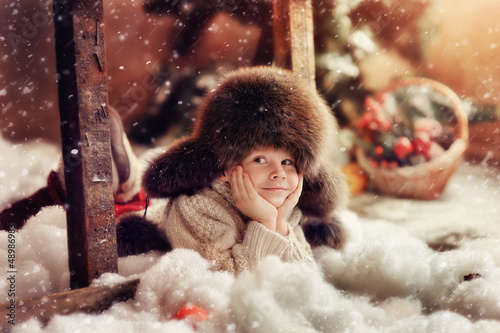 Photo: creative photo card is a smiling boy in a fur hat creative photo card is a smiling boy in a fur hat