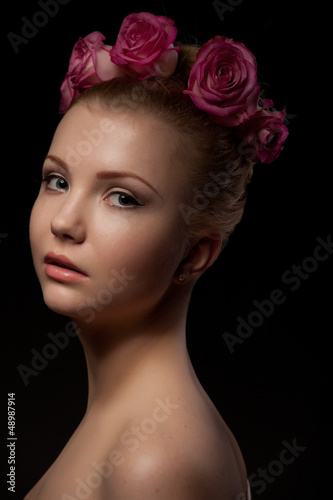 Photo: beautiful young woman beauty shot at dark background beautiful young woman beauty shot at dark background