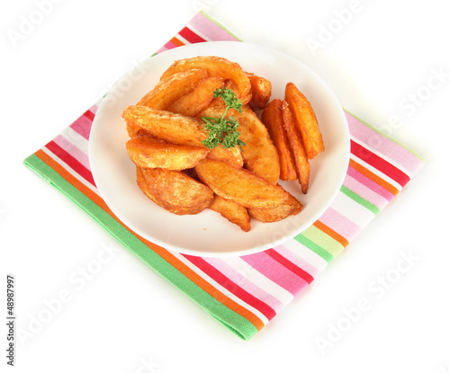 Photo: Appetizing village potatoes on plate isolated on white Appetizing village potatoes on plate isolated on white