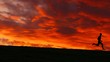 Filmclip eines Joggers vor morgenrotem Himmel