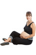 A pregnant woman, 9 months, holding her tummy