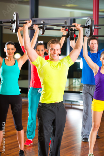 Photo: weight training in the gym with dumbbells weight training in the gym with dumbbells