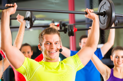 Photo: weight training in the gym with dumbbells weight training in the gym with dumbbells