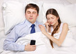 businessman and woman in bed