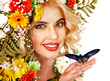 Foto: Woman with flower and butterfly. Woman with flower and butterfly.