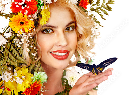 Photo: Woman with flower and butterfly. Woman with flower and butterfly.