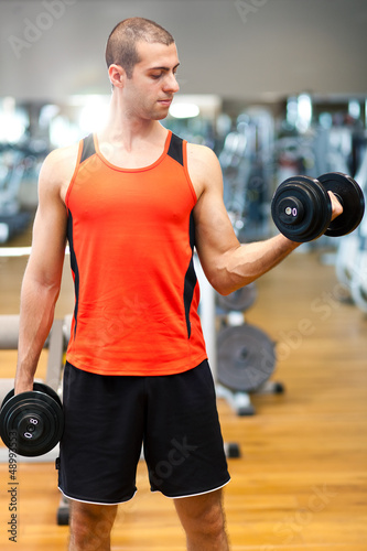Photo: Man lifting weights Man lifting weights